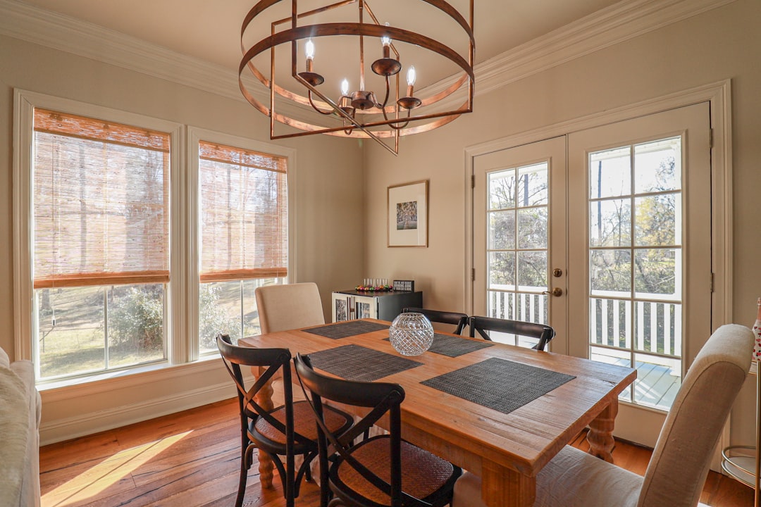 A beautiful Louisiana-style home with a prominent, well-maintained roof standing resilient under a bright, intense sun, symbolizing durability against heat and UV rays.