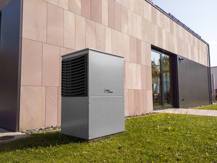 A modern HVAC system sits in a clean, brightly lit, and fully insulated attic, representing an energy-efficient and protected home system.